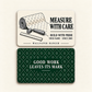 Front and reverse of the thin rounded Wallpaper Hanger aluminum wallet card: Measure with Care, Build with Pride and Wallpaper Hanger on the ivory front; Good Work Leaves Its Mark on the forest-green diamond-pattern reverse.