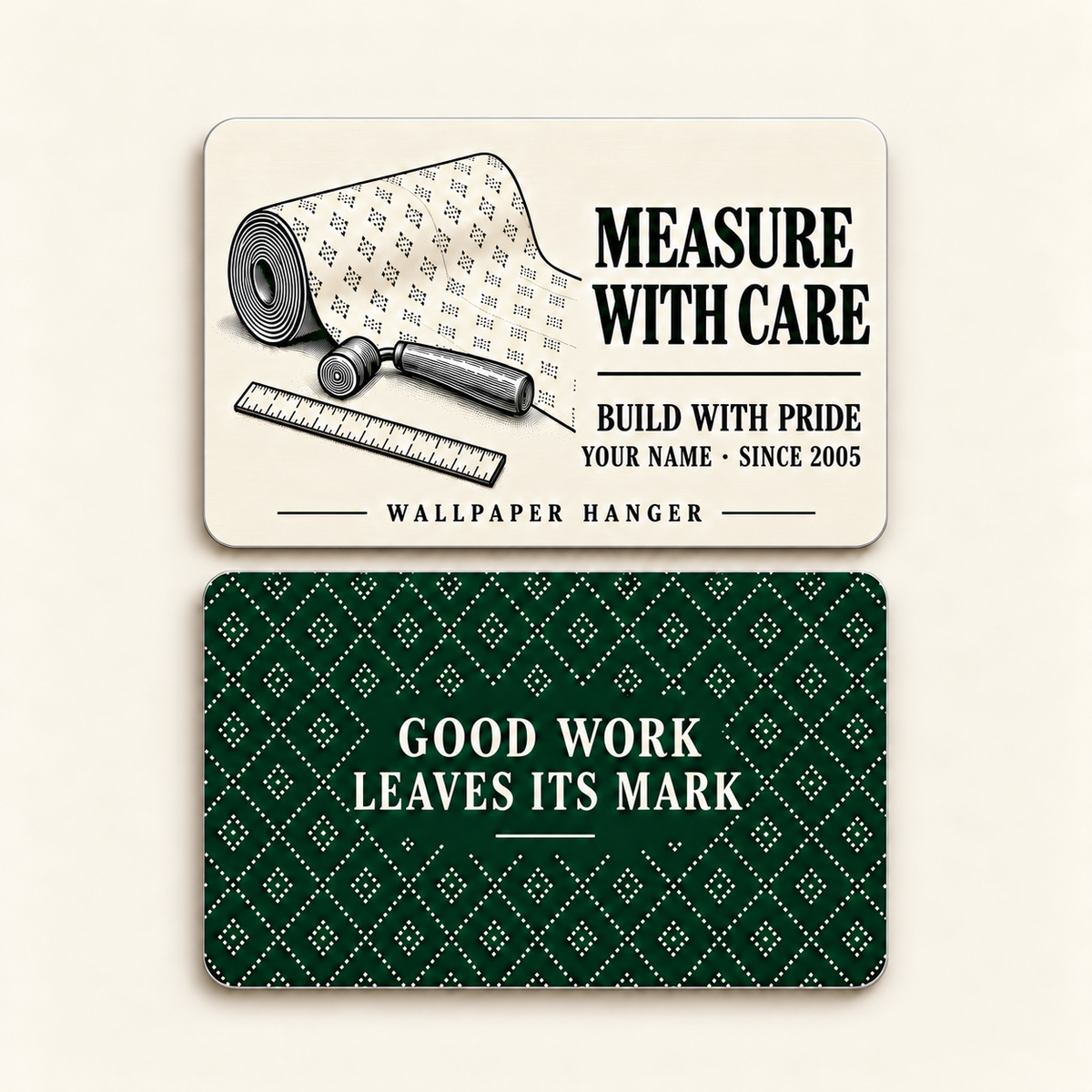 Front and reverse of the thin rounded Wallpaper Hanger aluminum wallet card: Measure with Care, Build with Pride and Wallpaper Hanger on the ivory front; Good Work Leaves Its Mark on the forest-green diamond-pattern reverse.