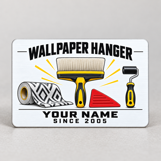 Wallpaper Hanger Minimal Tool Grid aluminum wallet card, front upright on a pale tabletop with wallpaper roll, smoothing brush and seam roller illustration.