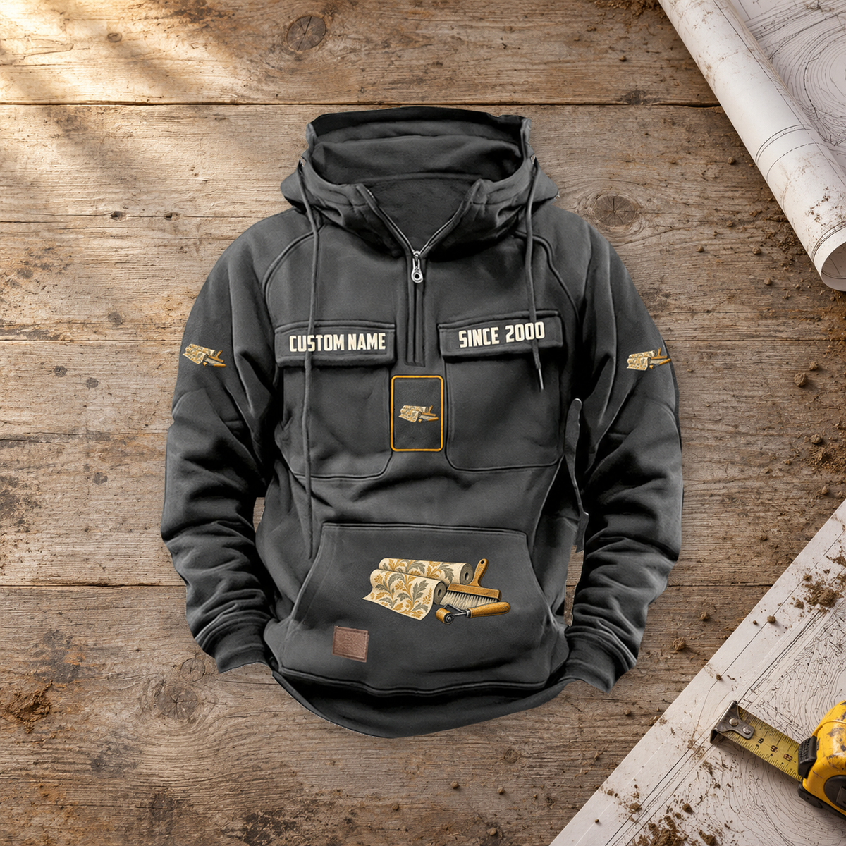 Wallpaper Hanger Never Ends Vintage Hoodie in Dark Gray on a warm planning workbench, single centered source-supported front view.