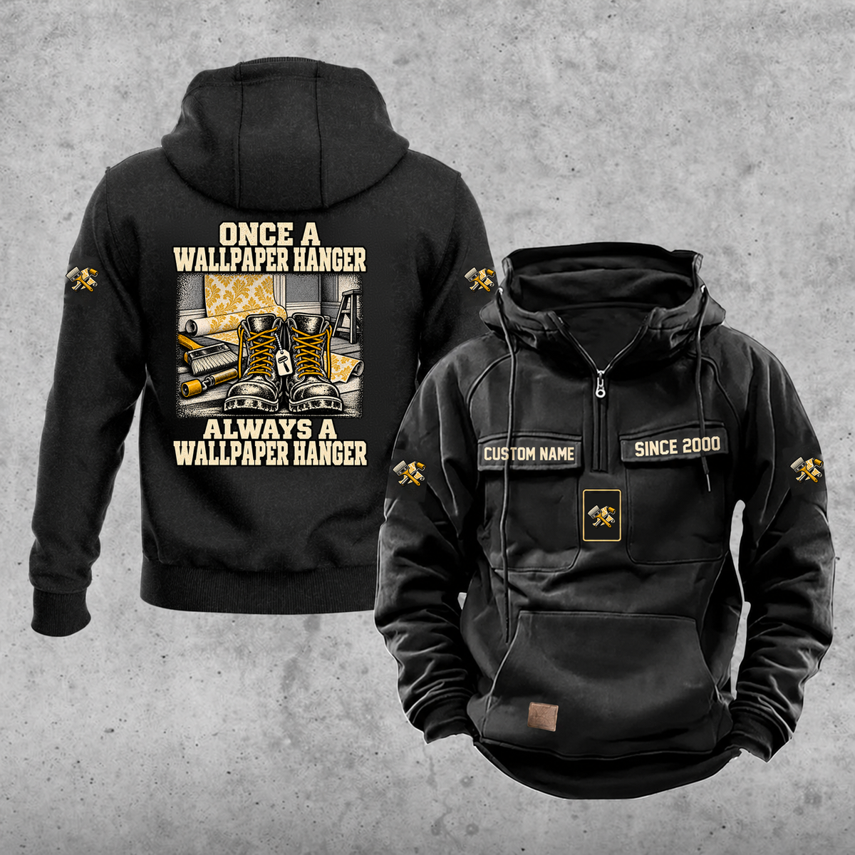 Wallpaper Hanger Once and Always Vintage Hoodie in Black, front and back views with work boots and wallpaper rolls, a smoothing brush and a seam roller, coordinated sleeve and chest emblems, and illustrative sample text CUSTOM NAME and SINCE 2000.