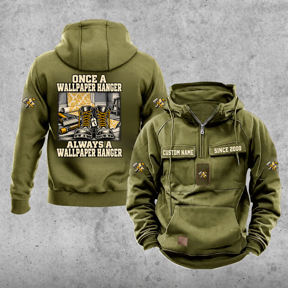 Wallpaper Hanger Once and Always Vintage Hoodie in Military Green, front and back views with work boots and wallpaper rolls, a smoothing brush and a seam roller, coordinated sleeve and chest emblems, and illustrative sample text CUSTOM NAME and SINCE 2000.