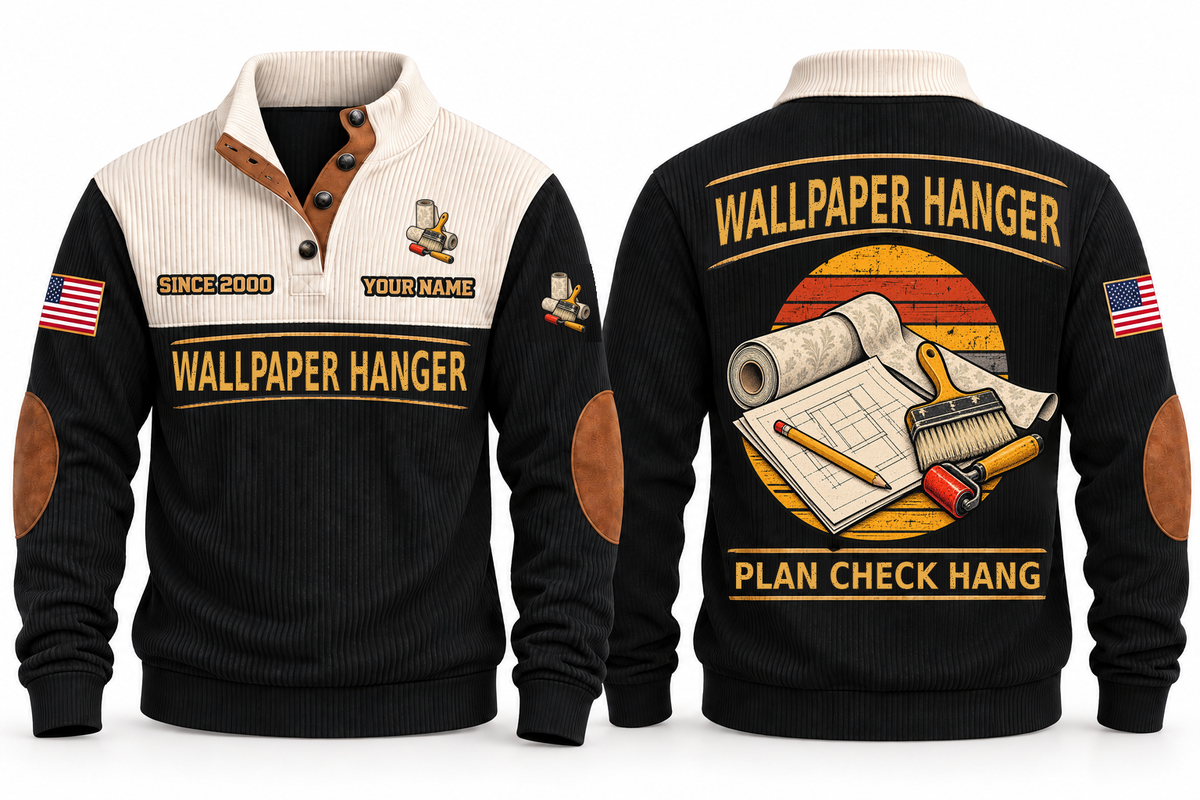 Wallpaper Hanger Plan Check Hang Sports Sweatshirt in Black, original front and back views. Wallpaper rolls, a paste brush and a seam roller over a plan sheet and pencil within a distressed sunset roundel. WALLPAPER HANGER and PLAN CHECK HANG lettering; YOUR NAME and SINCE 2000 are fixed illustrative sample text.