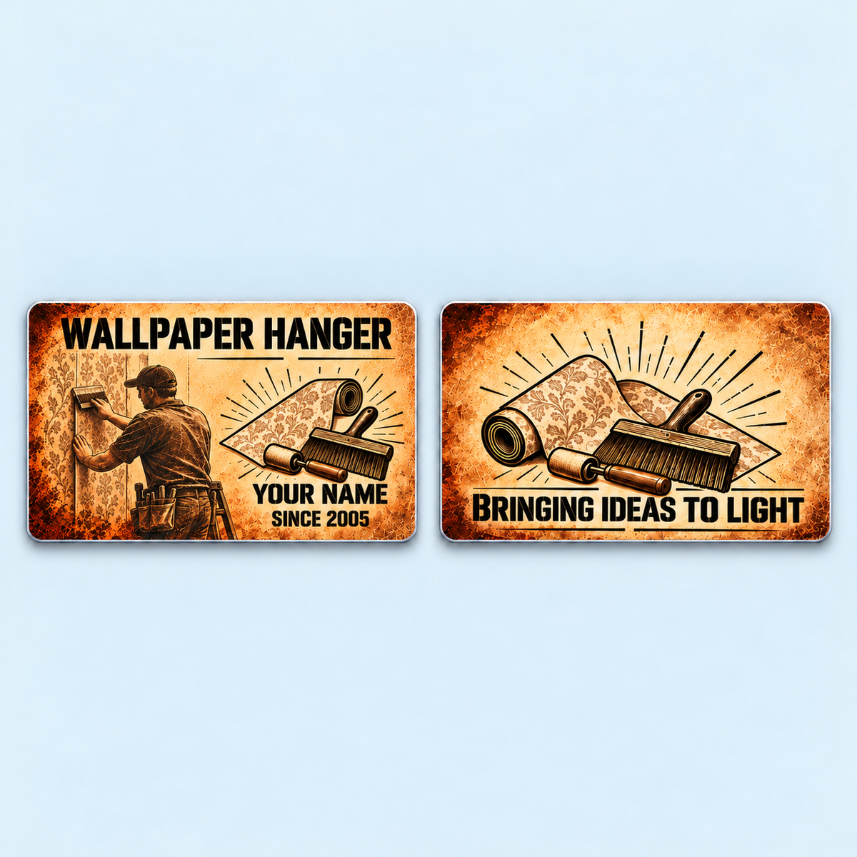 Front and reverse of the Wallpaper Hanger Sepia Legacy aluminum wallet card on a pale background, with illustrative YOUR NAME and SINCE 2005 text and BRINGING IDEAS TO LIGHT on the reverse.