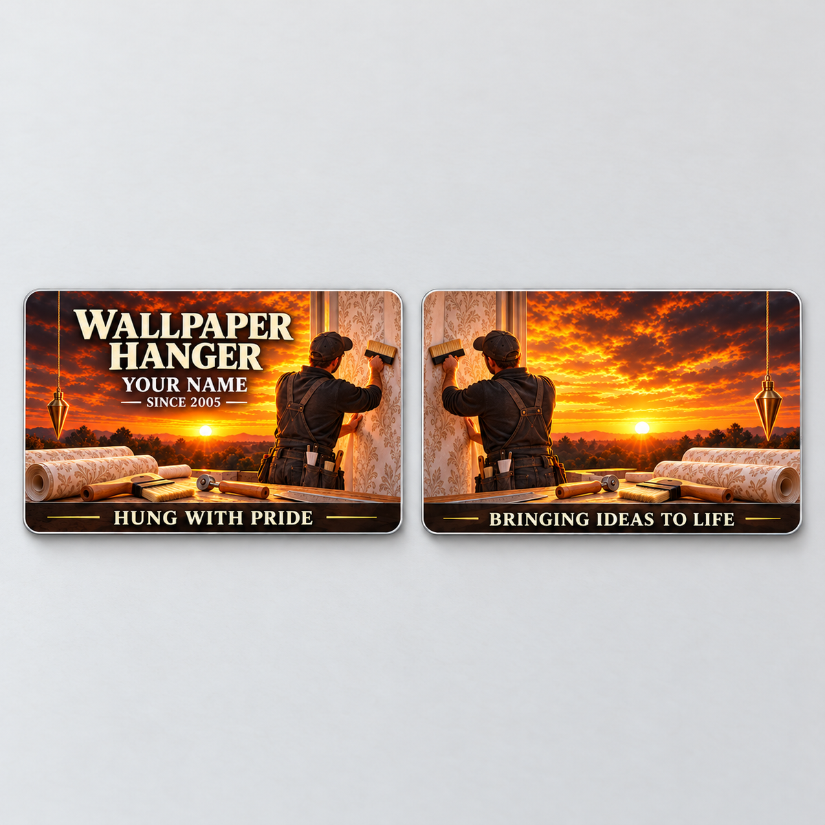 Front and reverse of one Wallpaper Hanger Sunset Workday aluminum wallet card, showing complementary wallpaper work scenes and cream motto lettering