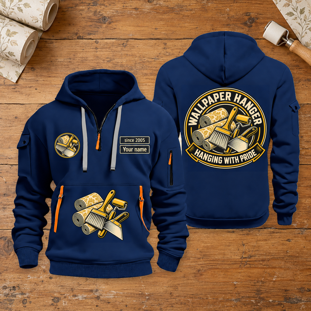 Wallpaper Hanger Hanging With Pride Quarter-Zip Hoodie in Navy, full authentic front and back views with matching wallpaper hanger tools and equipment artwork, original sample name/year and trade-pride badge lettering. On a wallpaper hanger workbench.