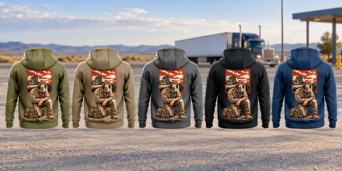 Five complete back views of the Trucker Ready Every Day Portrait Vintage Hoodie, left to right Military Green, Kaki, Dark Gray, Black and Dark Blue, arranged separately before a parked unbranded truck and open-road landscape. Each has the same compact road-and-truck panel above a larger kneeling trucker beside a travel bag.