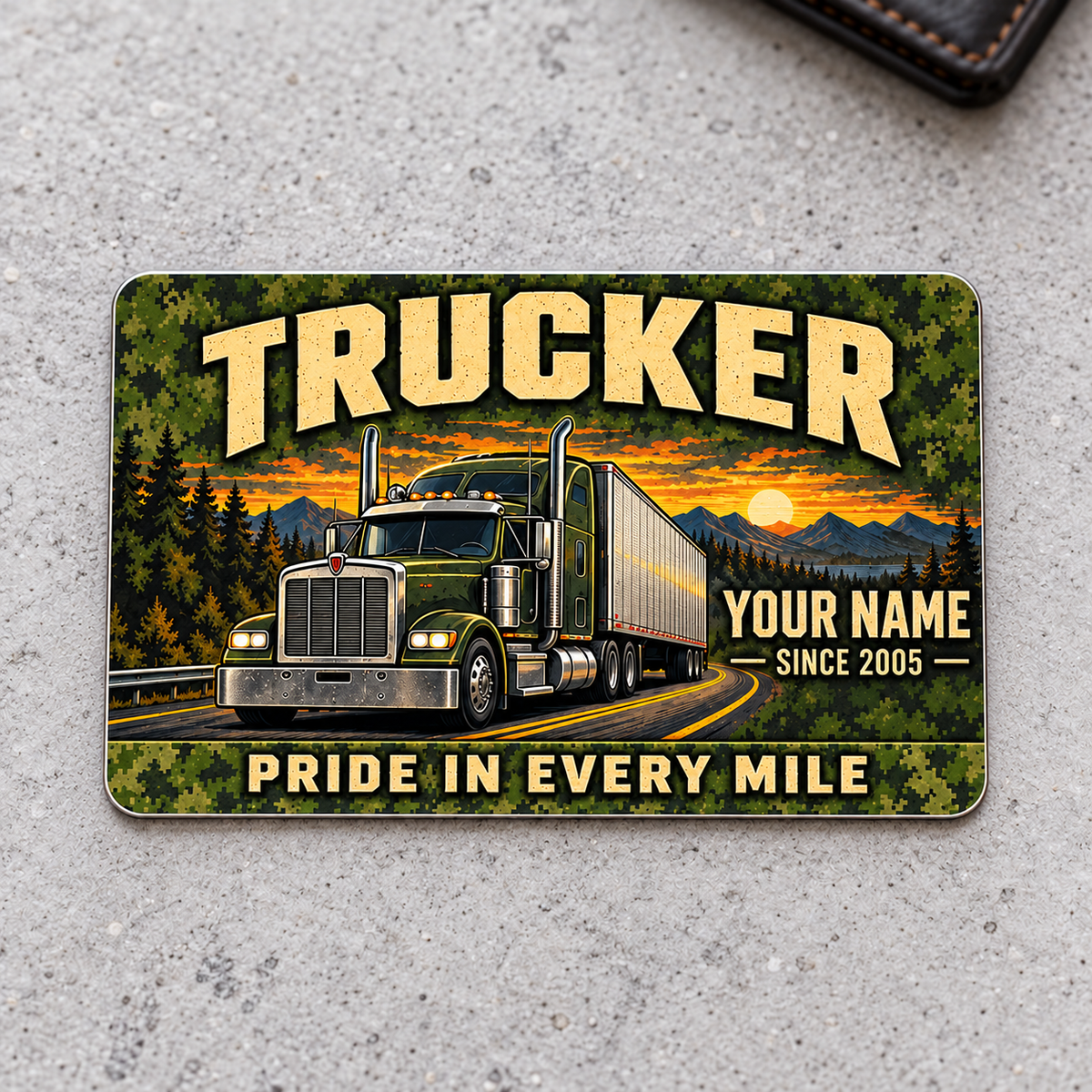 Trucker aluminum wallet card, rugged field front design on a gray tabletop