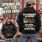Sprinkler Fitter Never Ends Vintage Hoodie in Black, worn front and back lifestyle views with original artwork and sample personalization.