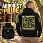 Black Arborist Once and Always Vintage Hoodie worn in an off-duty tree-care workshop portrait, with readable boots-and-tree back artwork and smaller front view showing CUSTOM NAME, SINCE 2000 and source pocket details.