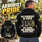 Black Arborist Never Ends Vintage Hoodie on an off-duty adult in a tree nursery, showing the back artwork and a smaller front view.