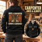 Black Carpenter Once and Always hoodie shown from the back in a woodworking workshop, with work-boot artwork and a smaller front-view inset.