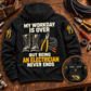 Black Electrician Never Ends Vintage Hoodie laid back-up on a dark timber workbench, with readable boots, pliers and cable artwork and a smaller front-view inset.