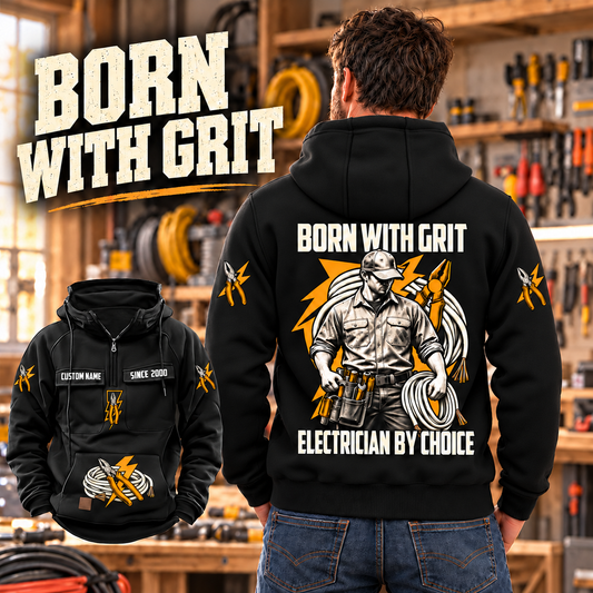 Black Electrician By Choice Vintage Hoodie shown on a back-facing model in a softly sunlit electrical workshop, with a smaller complete front inset and cream BORN WITH GRIT lettering.