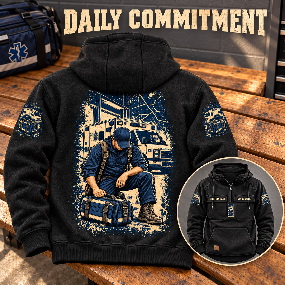 Black EMS Daily Commitment Portrait Vintage Hoodie on a station bench, showing the kneeling-worker back artwork and a smaller front inset with CUSTOM NAME and SINCE 2000.