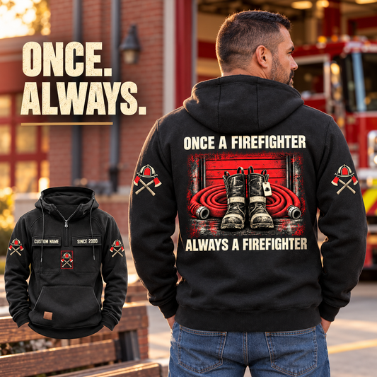 Black Firefighter Once and Always Vintage Hoodie with boots-and-hose back artwork on an off-duty model beside a fire-station bench, plus front inset.