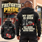 Black Firefighter Never Ends Vintage Hoodie shown on an off-duty rear-view model outside a fire station, with boots, helmet and axe artwork and a smaller front view.