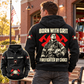 Black Firefighter By Choice vintage hoodie on an off-duty model outside a brick fire station, with a large back statement illustration and a smaller front-view inset.