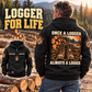 Black Logger Once and Always Vintage Hoodie on a relaxed model at a timber landing, with boots and cut-log back artwork and a small front inset.