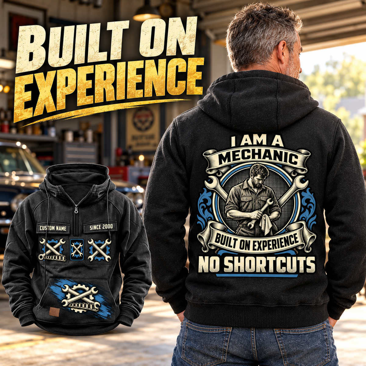 Black Mechanic Heritage Crest Vintage Hoodie on an adult viewed from behind in a quiet garage, showing the cream and blue mechanic crest with a smaller complete front view.