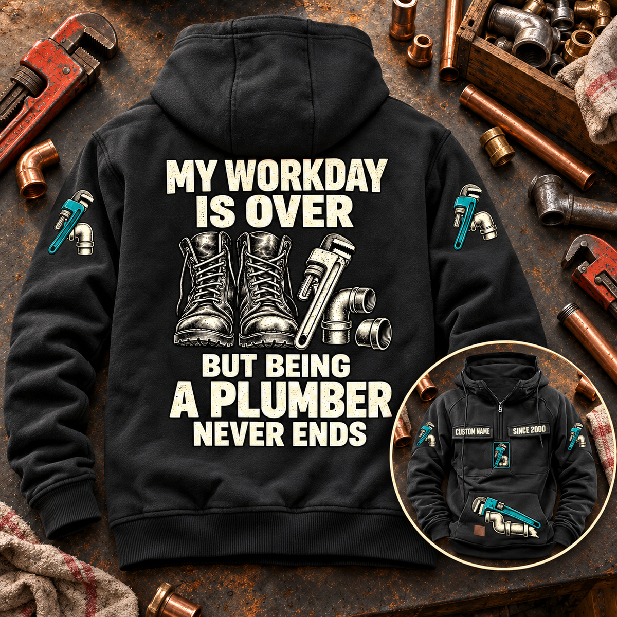 Black Plumber Never Ends Vintage Hoodie shown from the back on a plumbing workbench, with cream boots and tool artwork and a smaller front-view inset.