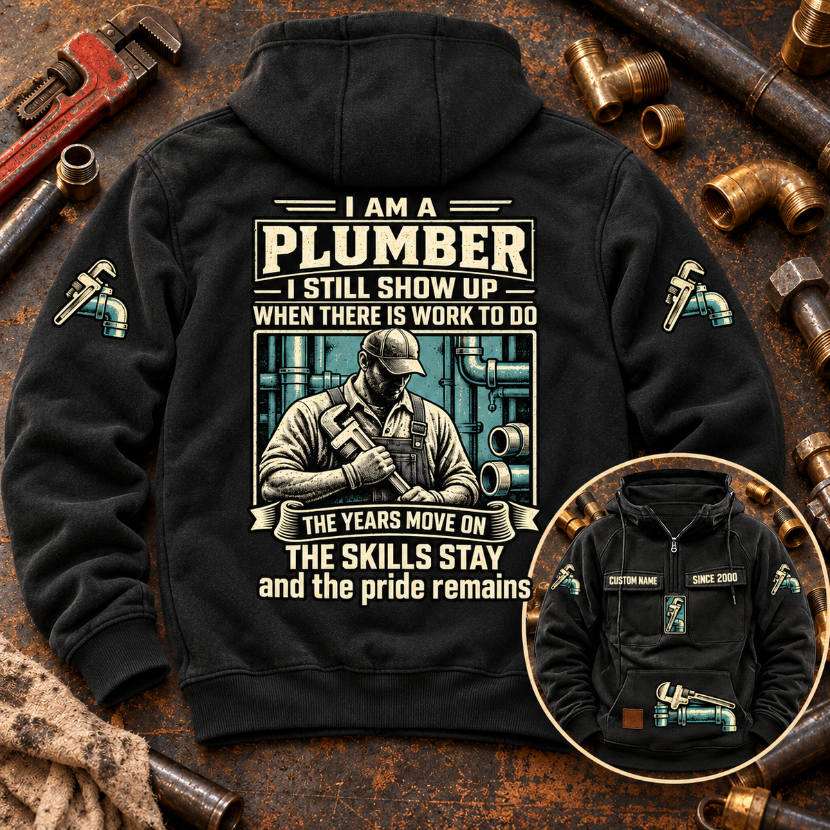 Black Plumber Skills and Pride Vintage Hoodie displayed back-up on a plumbing workbench, with cream and teal portrait artwork and a smaller front-view inset.