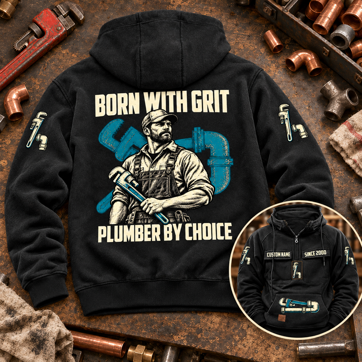 Black Plumber By Choice Vintage Hoodie on a plumbing workbench, showing the BORN WITH GRIT plumber portrait back artwork and a smaller front-view inset.