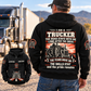 Black Trucker Skills and Pride Vintage Hoodie worn by an off-duty driver beside a parked truck, showing the trucker portrait back graphic and a smaller front-view inset.