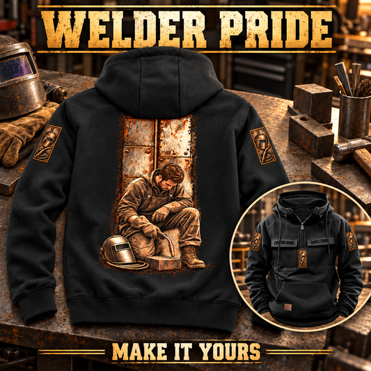 Black Welder Daily Commitment Portrait Vintage Hoodie with tall steel-panel kneeling welder back artwork and smaller front inset on a workshop bench.