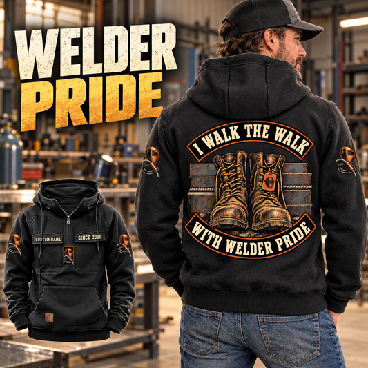 Black Welder Walk the Walk Badge Vintage Hoodie worn from the back in a quiet metalworking workshop, with a smaller front view showing CUSTOM NAME and SINCE 2000.