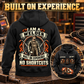 Black Welder Heritage Crest Vintage Hoodie with a large back view and smaller front inset in a quiet welding workshop.
