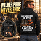 Black Welder Never Ends Vintage Hoodie on an off-duty model in a welding workshop, with large back artwork and smaller front view.