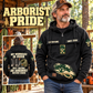 Arborist Never Ends Vintage Hoodie in Black, front right back card composition with faithful front and back artwork in a calm arborist equipment shed beside leafy trees.