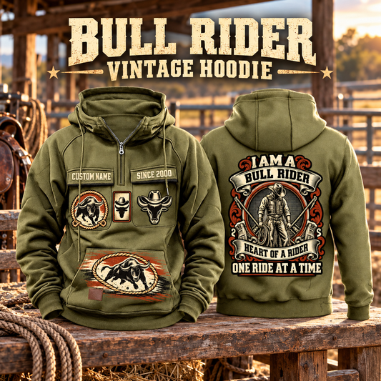 Bull Rider Heritage Crest Vintage Hoodie in Military Green, paired front back composition with faithful front and back artwork in a weathered timber rodeo stable, outdoors.