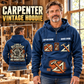 Carpenter Heritage Crest Vintage Hoodie in Dark Blue, front right back card composition with faithful front and back artwork in a warm timber workshop or wood-paneled porch.