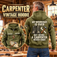 Carpenter Never Ends Vintage Hoodie in Military Green, back right front inset composition with faithful front and back artwork in a warm timber workshop or wood-paneled porch.