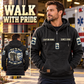 EMS Walk the Walk Badge Vintage Hoodie in Black, front right back card composition with faithful front and back artwork in a calm station entrance with a parked ambulance softly out of focus.