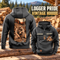 Logger Workday Portrait Vintage Hoodie in Dark Gray, back left front cutout composition with faithful front and back artwork in a timber yard with stacked logs softly out of focus.
