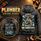 Plumber Heritage Crest Vintage Hoodie in Dark Gray, back right front inset composition with faithful front and back artwork in a tidy plumbing workbench with muted metal pipe fittings.