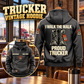 Trucker Proud Walk Vintage Hoodie in Dark Gray, back right front inset composition with faithful front and back artwork in a quiet roadside truck stop with a parked tractor cab blurred behind.