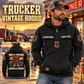 Trucker Once and Always Vintage Hoodie in Black, front right back card composition with faithful front and back artwork in a quiet roadside truck stop with a parked tractor cab blurred behind.