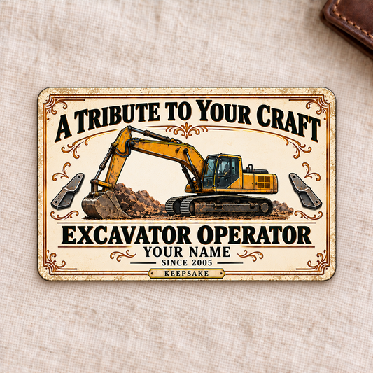 Front of the Ivory Heritage Tribute Excavator Operator aluminum wallet card on cream linen.