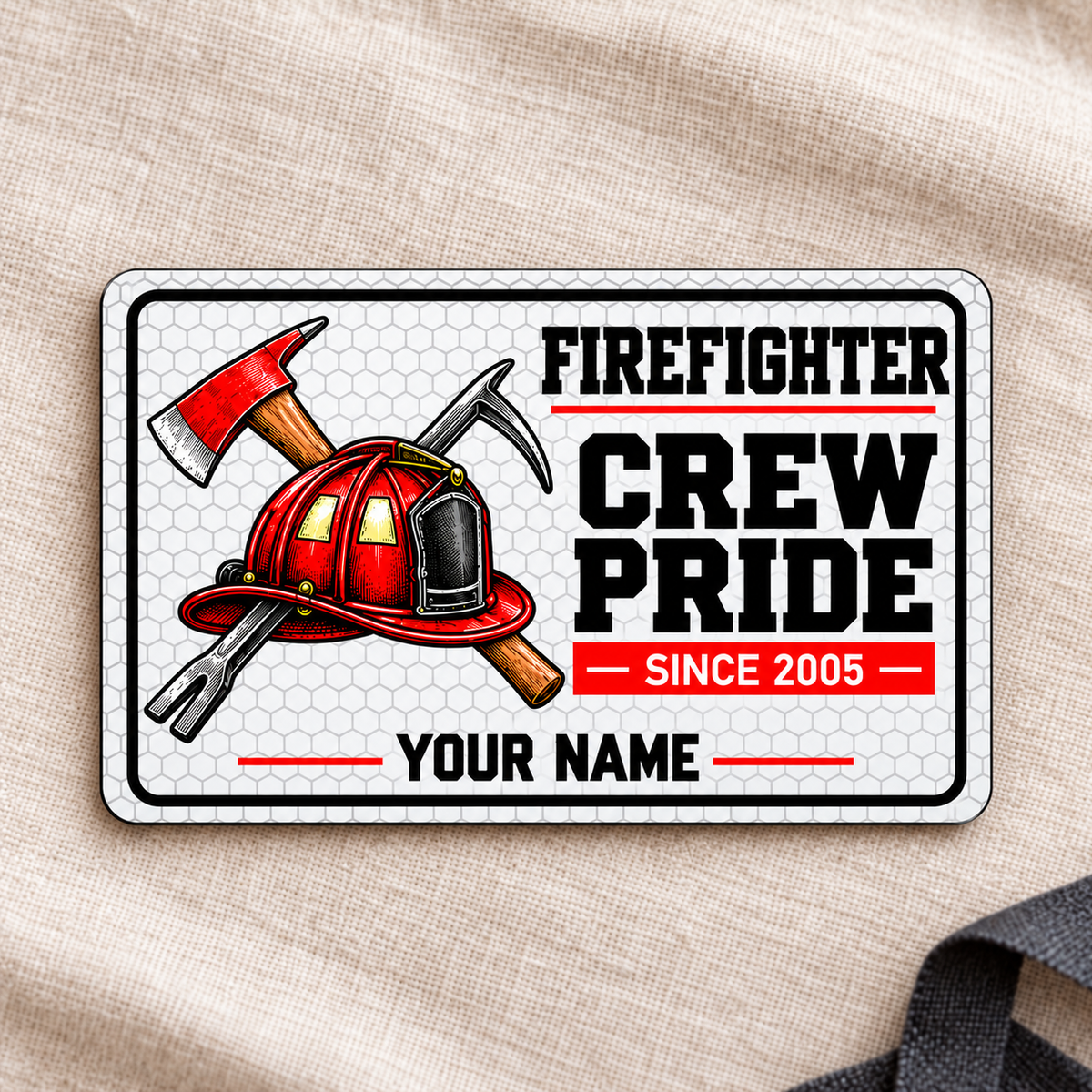 Front of honeycomb Firefighter Crew Pride aluminum wallet card on cream linen.