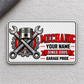 Front of Mechanic Honeycomb Pride aluminum wallet card on light gray woven fabric.