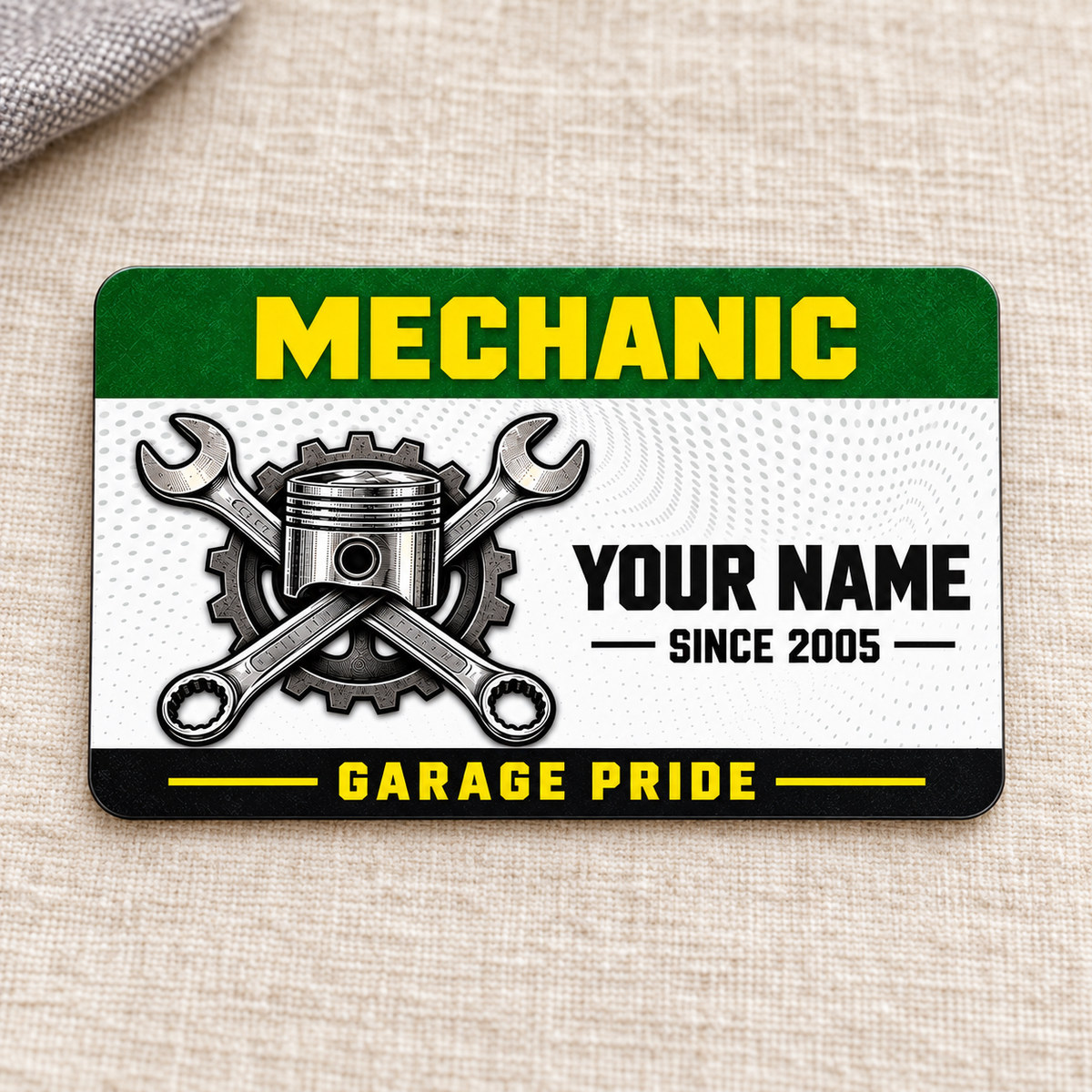 Front of Mechanic Green Band aluminum wallet card on cream linen.