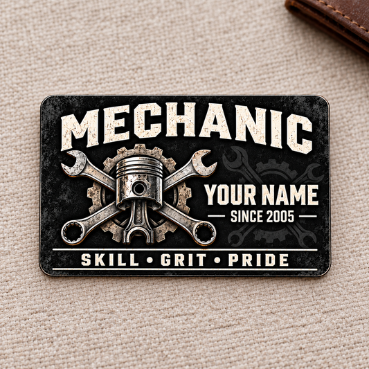 Front of Mechanic Midnight Pride aluminum wallet card on warm woven fabric.
