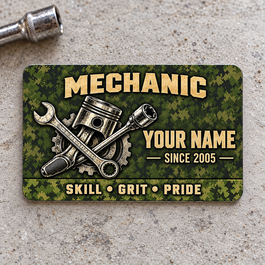 Front of Mechanic Rugged Field aluminum wallet card on pale gray concrete.