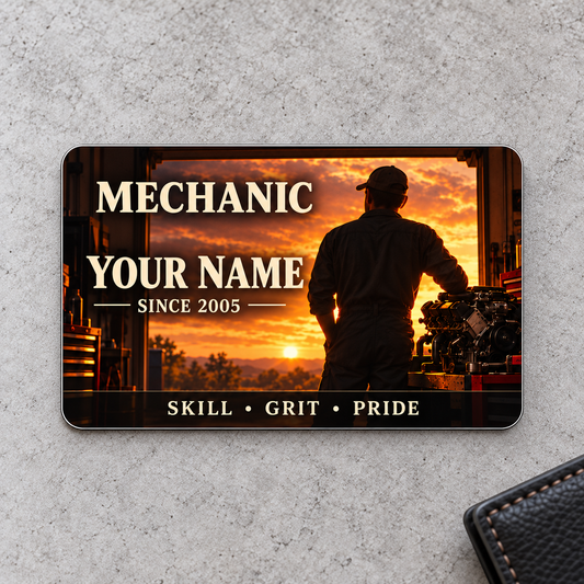 Front of Mechanic Sunset Workday aluminum wallet card on pale gray concrete.