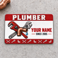 Plumber Red Header aluminum wallet card, front design on gray concrete.
