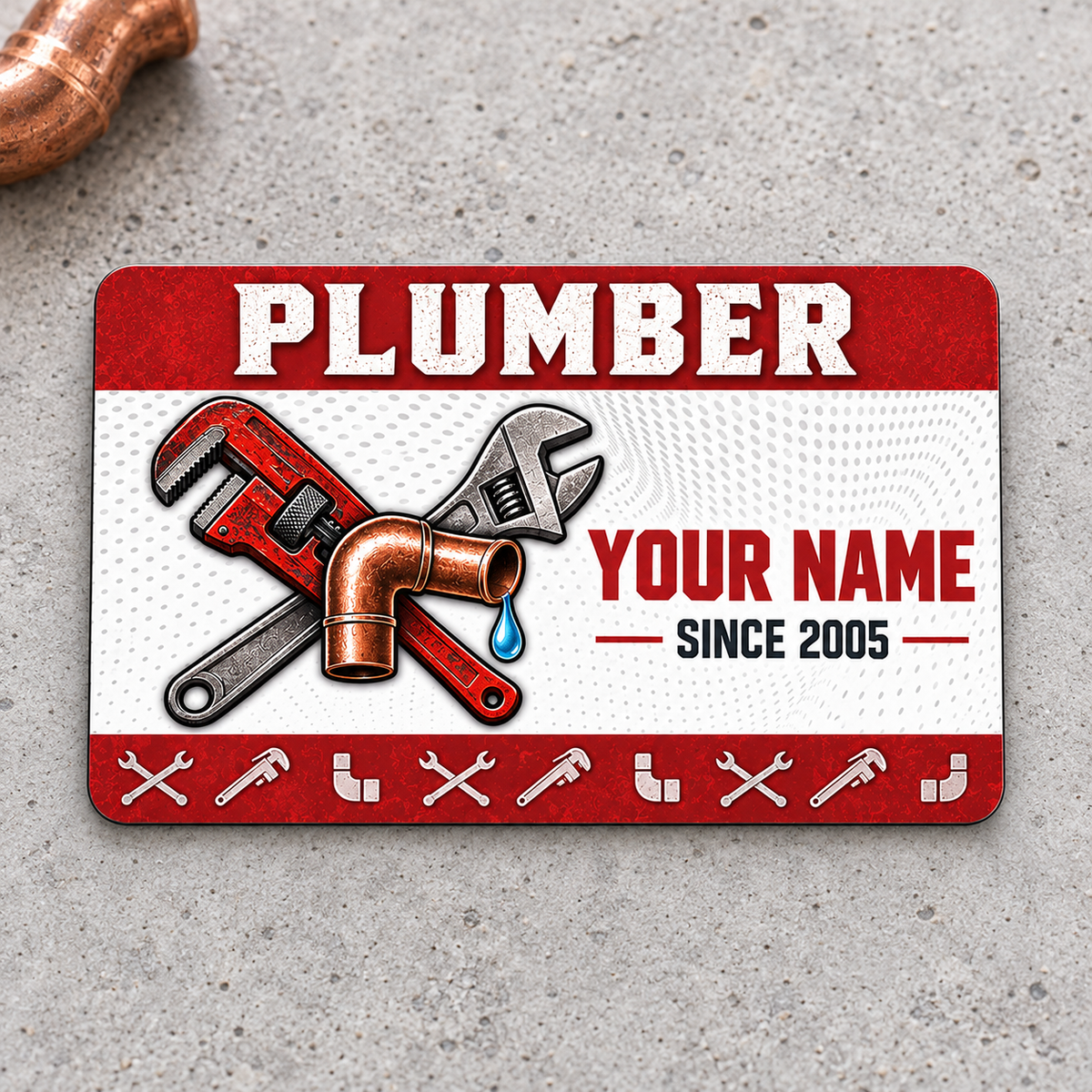 Plumber Red Header aluminum wallet card, front design on gray concrete.